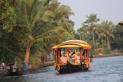 Man sitting in gondola sailing on river