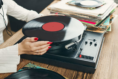 Playing music from vinyl record. analog record. retro and vintage style. listening to music from lp