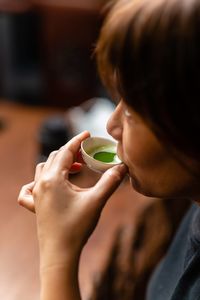 Cropped image of woman holding ice cream