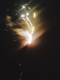 Low angle view of illuminated lights at night