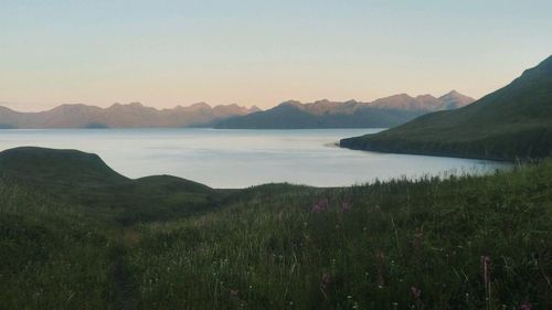 Scenic view of lake against sky during sunset