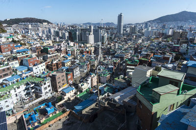 High angle view of illuminated city buildings against sky