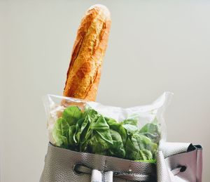 Close-up of burger against white background