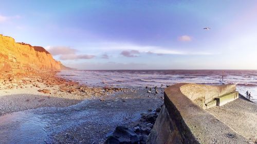 Scenic view of sea against cloudy sky