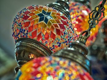 Low angle view of colorful lamps hanging at market