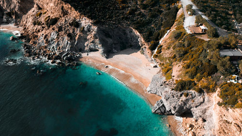 Aerial view of beach by rock formation