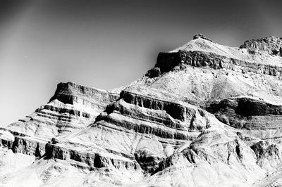 Low angle view of snowcapped mountain against sky