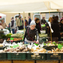 Group of people at market stall