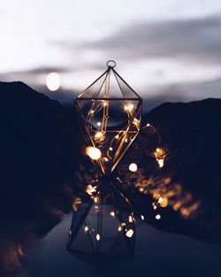 Close-up of illuminated lighting decoration at beach