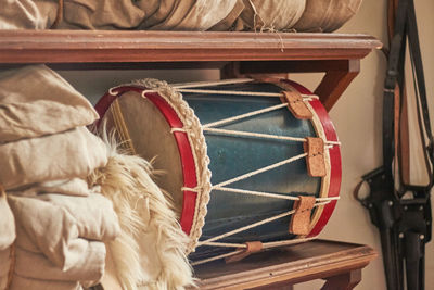 Drum on wooden shelf