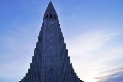 Low angle view of clock tower against sky