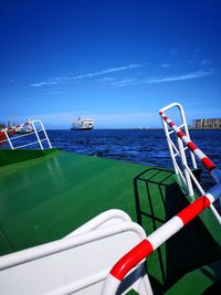 Boat on sea against blue sky