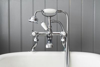Close-up of shower head in bathtub