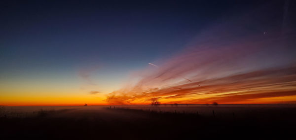 Scenic view of dramatic sky during sunset