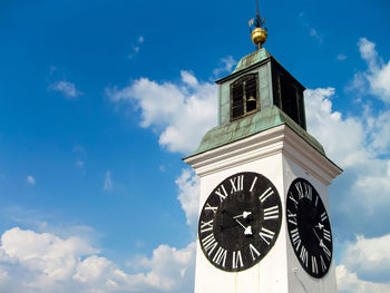 Low angle view of clock tower against sky