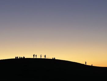 Silhouette people at sunset