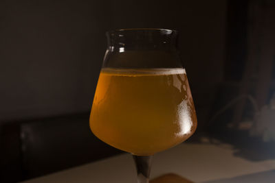 Close-up of beer glass on table