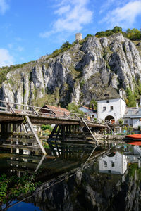 Panoramic view of buildings and mountains against sky