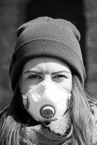 Portrait of woman wearing mask outdoors