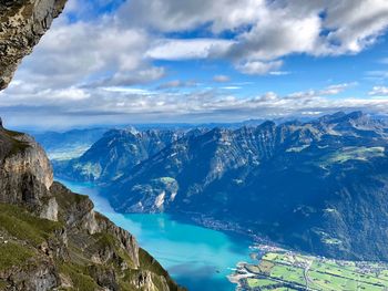 Scenic view of mountains against blue sky