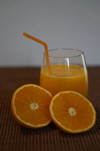 Close-up of orange juice on table