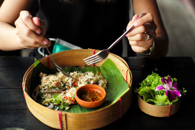 Midsection of woman preparing food