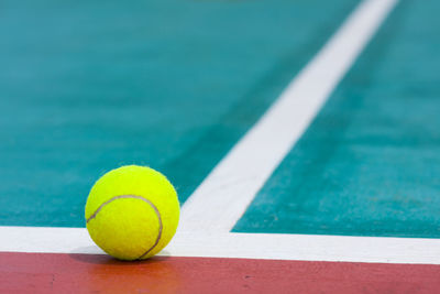 Close-up of tennis ball on court