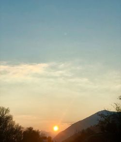 Low angle view of silhouette mountain against sky during sunset