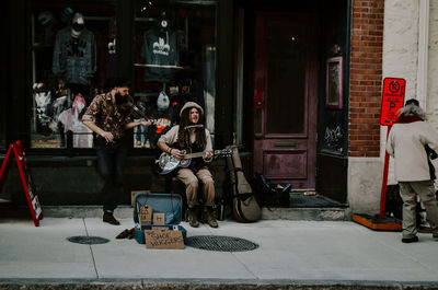 Man sitting on guitar