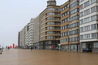 Buildings in city against sky