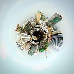 Little planet effect of buildings against sky