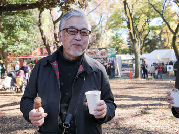 Portrait of young man drinking coffee