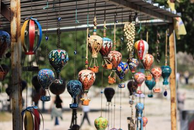 Close-up of decorations hanging for sale