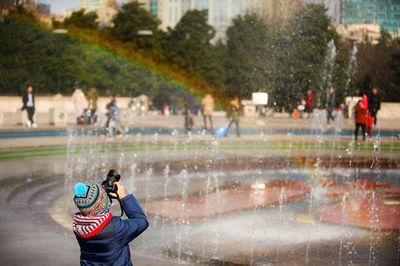 People photographing in water