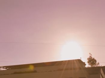 Low angle view of built structure at sunset