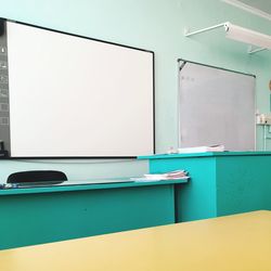 View of empty chairs on table in building