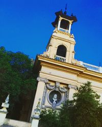 Low angle view of building against blue sky