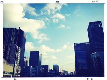 Low angle view of building against cloudy sky