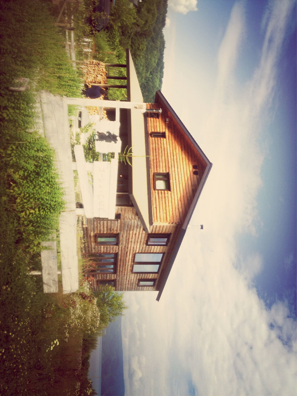 building exterior, architecture, built structure, sky, house, tree, cloud - sky, residential structure, grass, cloud, residential building, outdoors, day, nature, no people, tranquility, water, sunlight, roof, tranquil scene