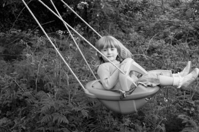 Portrait of smiling girl sitting on grass