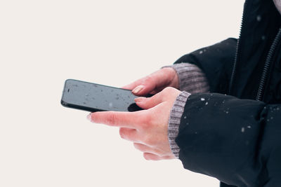 Close-up of man using mobile phone