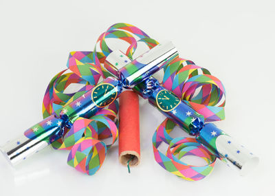 High angle view of multi colored pencils on white background