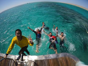 People enjoying in sea