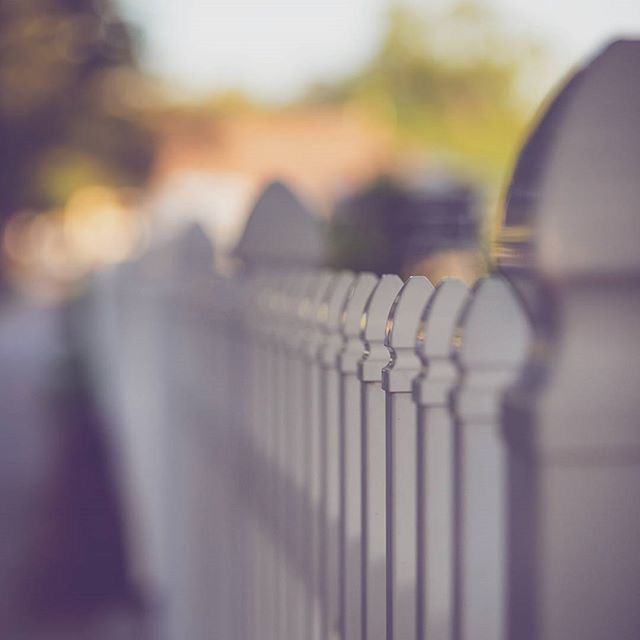 focus on foreground, selective focus, close-up, metal, indoors, transportation, no people, railing, metallic, in a row, reflection, day, surface level, focus on background, fence, pattern, glass - material, illuminated, empty