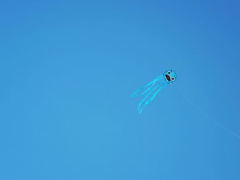 Low angle view of kite flying in sky