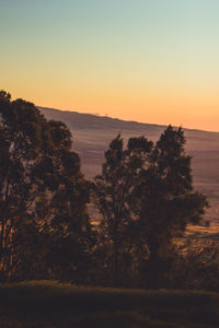 Scenic view of sea against clear sky during sunset