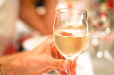 Close-up of hand holding wineglass