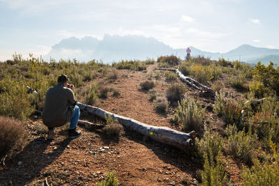 Rear view of man looking at mountain