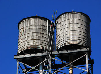 Low angle view of water tower against clear sky