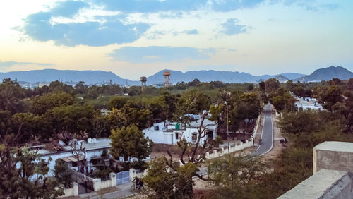 High angle view of trees and buildings against sky